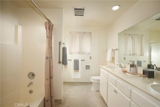 bathroom featuring shower / bath combination with curtain, a sink, toilet, and double vanity