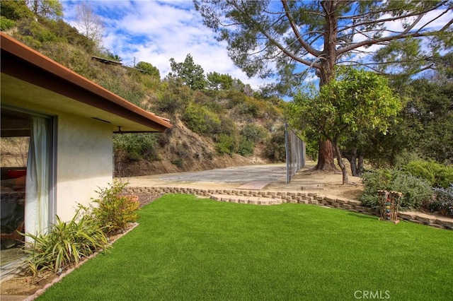 view of yard featuring a patio area and fence