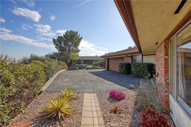 view of patio / terrace with an attached garage