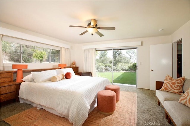 carpeted bedroom with access to exterior and a ceiling fan