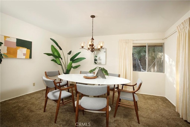 dining room with an inviting chandelier and dark carpet