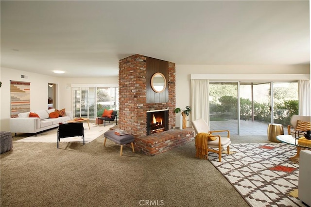 living room featuring light carpet and a brick fireplace