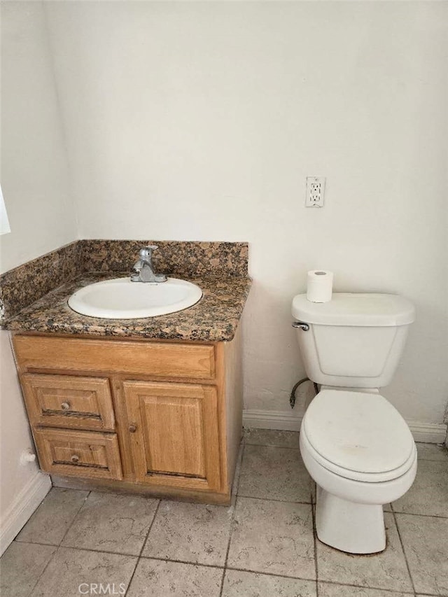 612 W Ramona Rd, Alhambra, CA 91803 - half bath with toilet, baseboards, stone tile flooring, and vanity