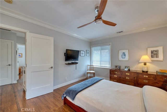 bedroom featuring baseboards, visible vents, dark wood-style flooring, and ornamental molding