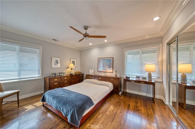 bedroom featuring crown molding, multiple windows, dark wood finished floors, and baseboards