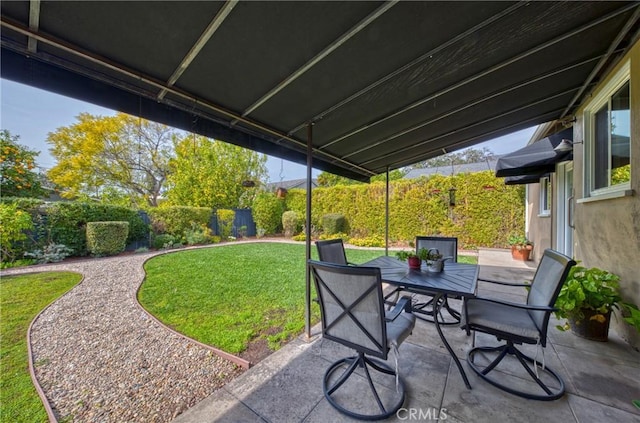 view of patio / terrace featuring a fenced backyard and outdoor dining area