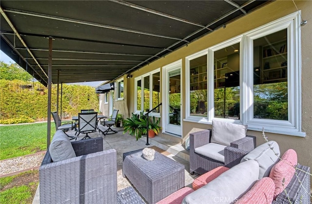 view of patio with an outdoor living space and outdoor dining space