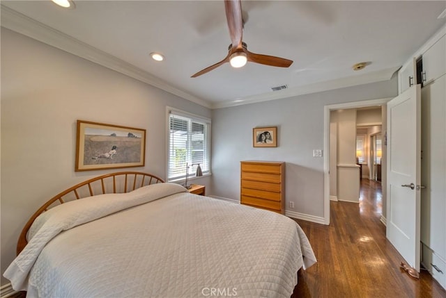 bedroom with recessed lighting, dark wood-type flooring, visible vents, baseboards, and ornamental molding