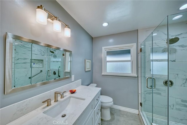 bathroom featuring toilet, a marble finish shower, vanity, and baseboards