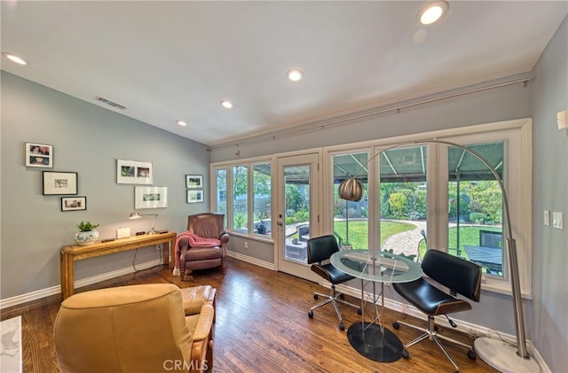 office space featuring baseboards, visible vents, lofted ceiling, dark wood-type flooring, and recessed lighting