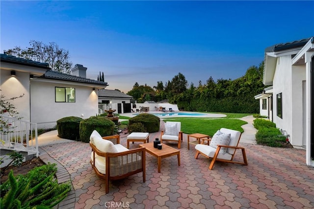 view of patio featuring a fenced in pool, fence, and an outdoor living space