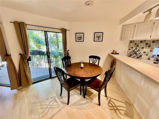 dining room with light wood-style floors