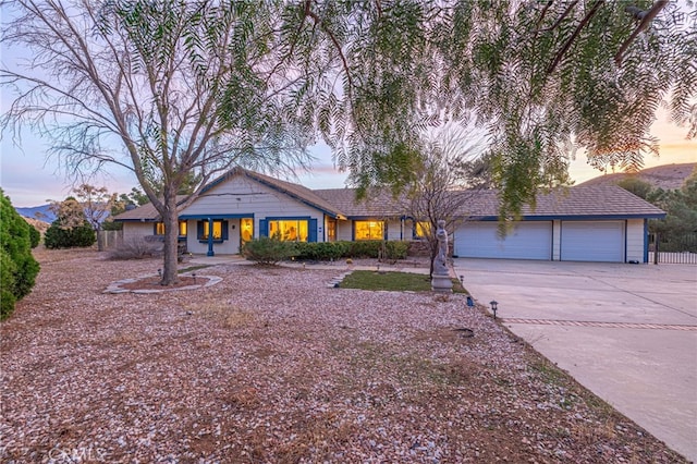 view of front of property with a garage and driveway