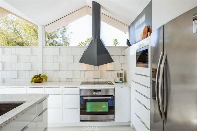 kitchen with stainless steel appliances, white cabinets, decorative backsplash, modern cabinets, and island exhaust hood