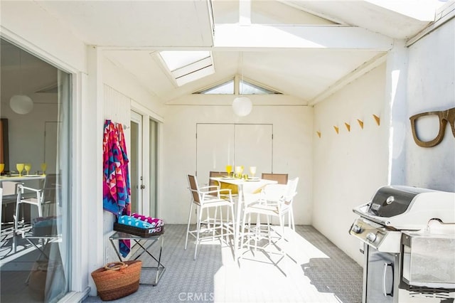 dining room with vaulted ceiling