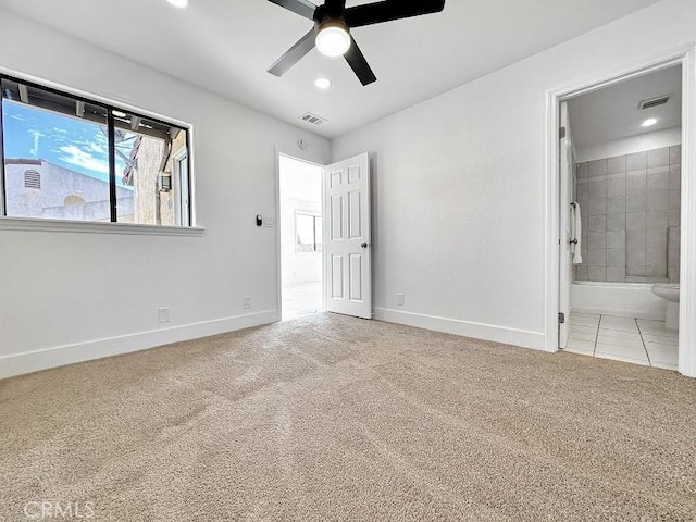 unfurnished bedroom with visible vents, baseboards, ensuite bath, and carpet floors