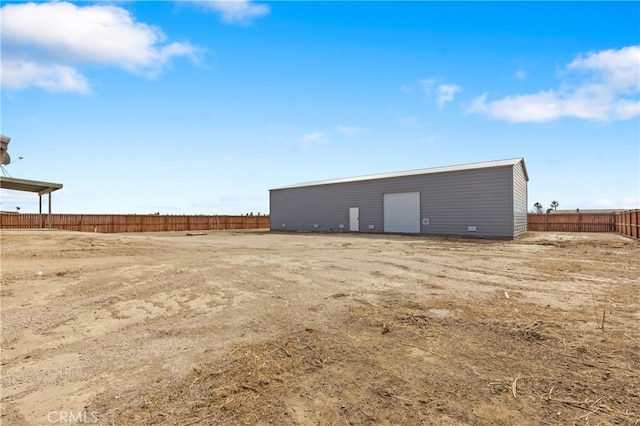 view of outbuilding with fence