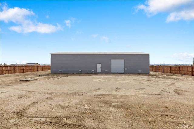 view of outbuilding with fence