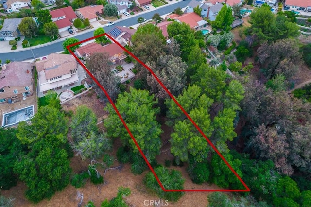 birds eye view of property with a residential view