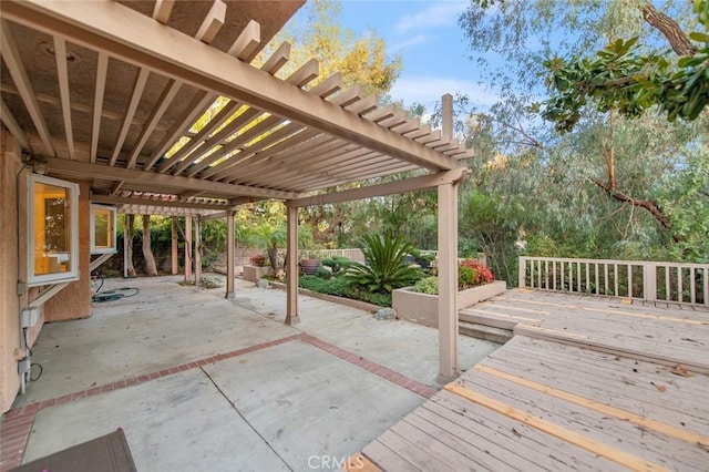 view of patio with a fenced backyard, a deck, and a pergola