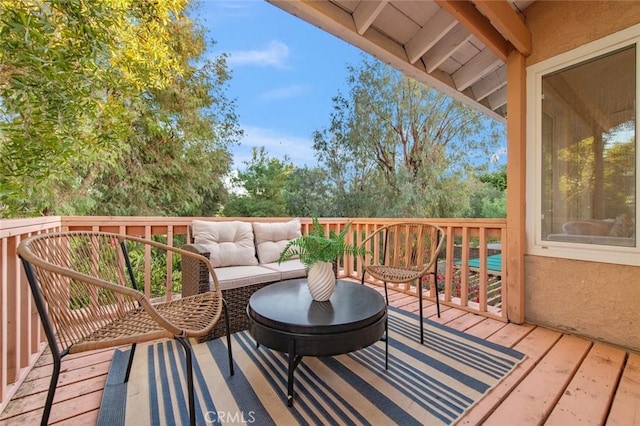 deck with an outdoor hangout area