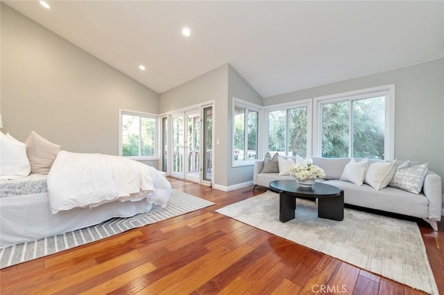 bedroom featuring high vaulted ceiling, recessed lighting, wood finished floors, baseboards, and access to outside