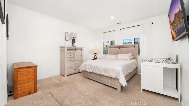 bedroom with recessed lighting, visible vents, and light colored carpet