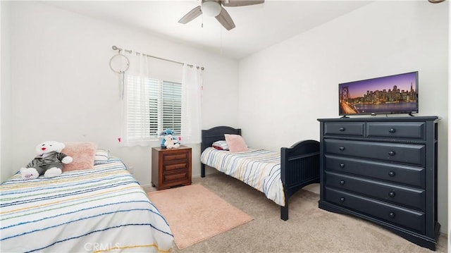 bedroom with light carpet and ceiling fan