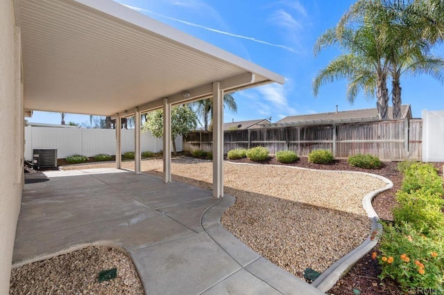 view of patio / terrace with a fenced backyard and central AC unit