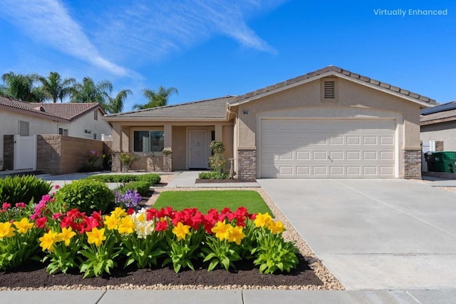 ranch-style home featuring driveway, stone siding, an attached garage, fence, and stucco siding