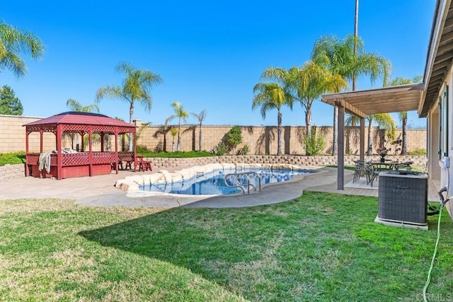 view of yard featuring a patio area, a fenced backyard, central AC, and a gazebo