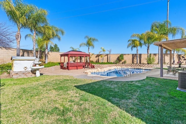 view of swimming pool with a patio area, a fenced backyard, and a gazebo