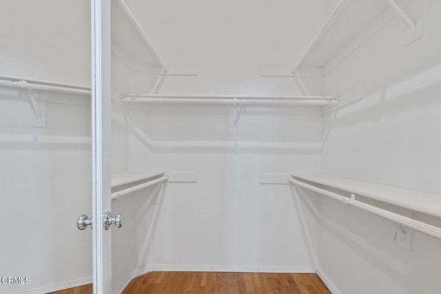 spacious closet with wood finished floors