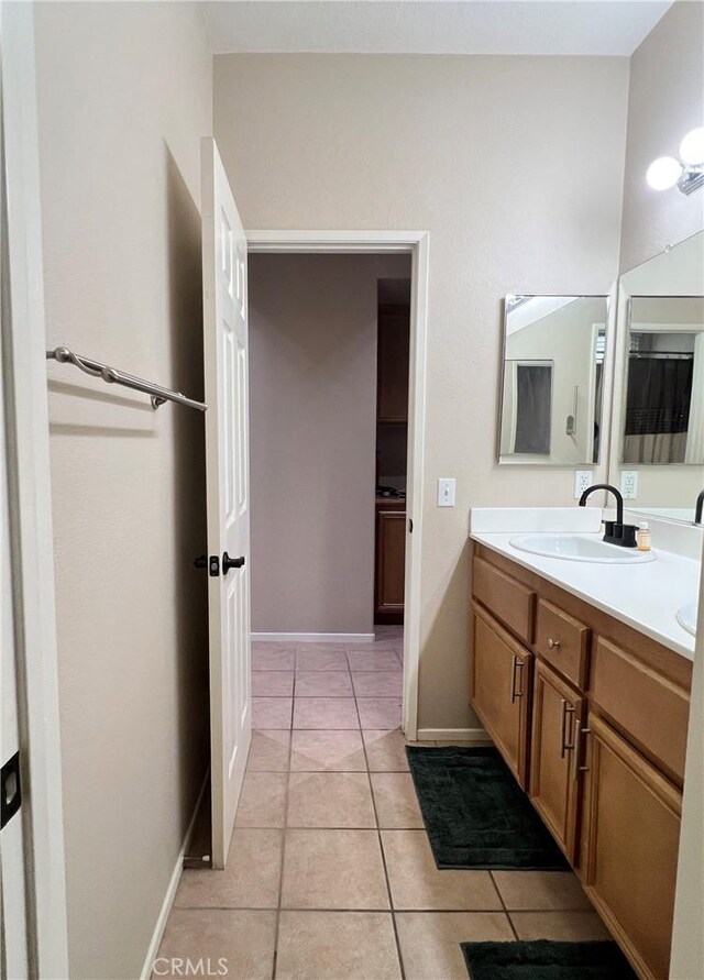 30659 Lajoe St, Menifee, CA 92584 - bathroom featuring tile patterned floors, double vanity, and baseboards