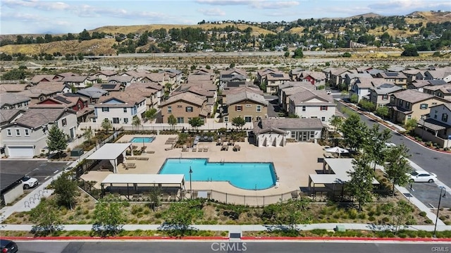 drone / aerial view with a residential view and a mountain view