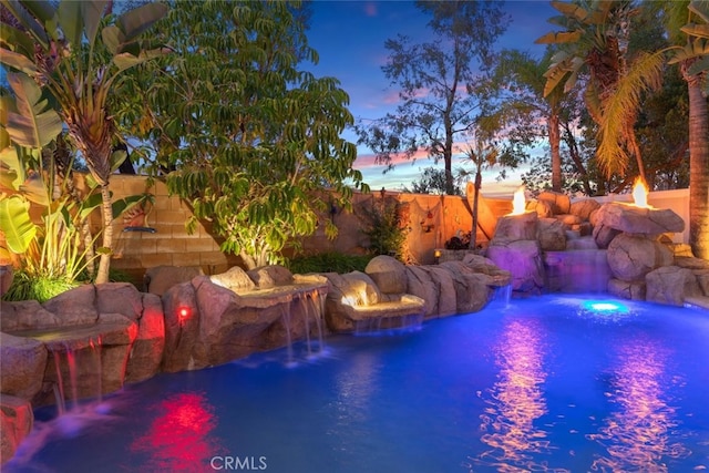 view of swimming pool with a fenced backyard and a fenced in pool