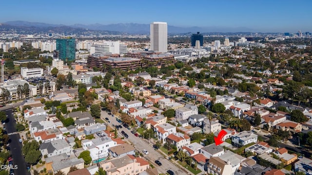 birds eye view of property featuring a view of city and a mountain view