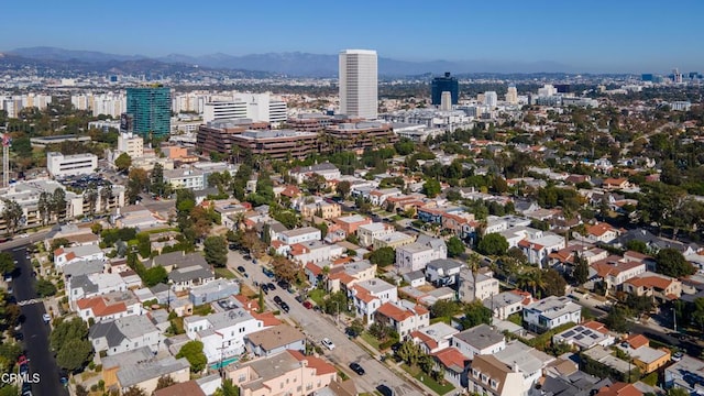 birds eye view of property with a view of city and a mountain view