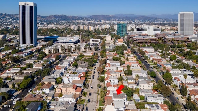 bird's eye view with a mountain view and a city view