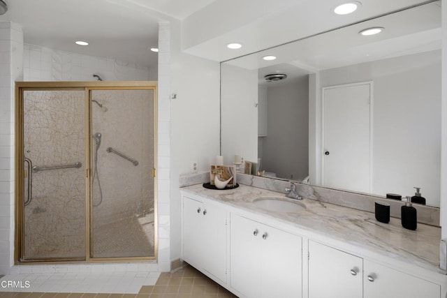 bathroom with tile patterned flooring, recessed lighting, visible vents, vanity, and a stall shower