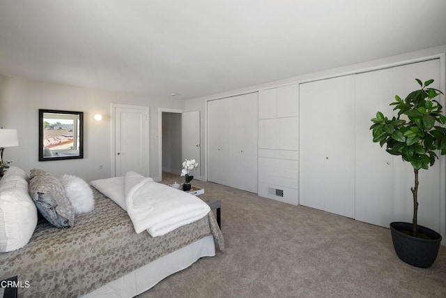 bedroom with carpet and visible vents