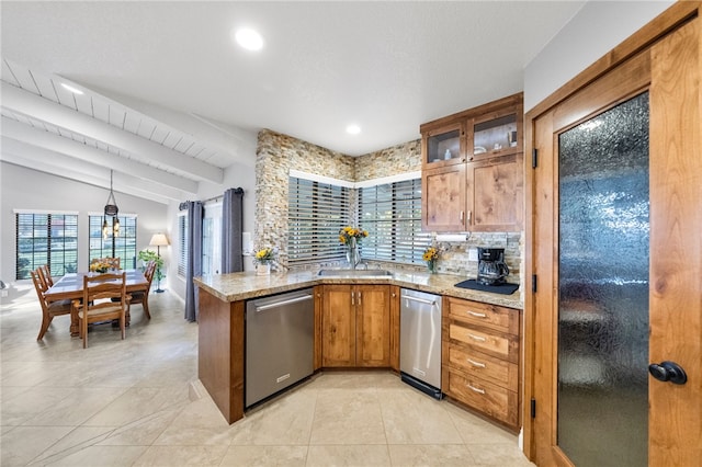 kitchen with dishwasher, lofted ceiling with beams, light stone countertops, and backsplash