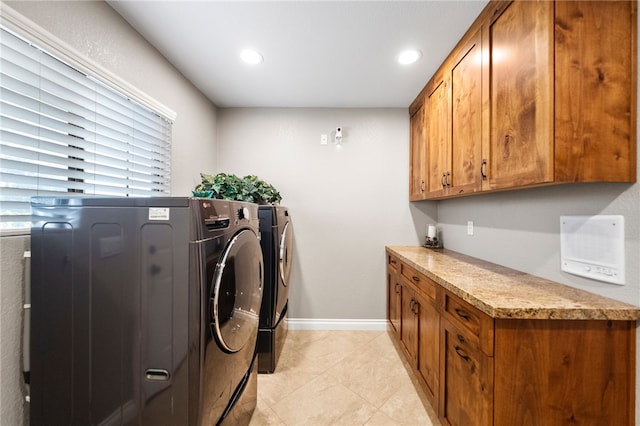 laundry room featuring light tile patterned floors, baseboards, recessed lighting, cabinet space, and independent washer and dryer