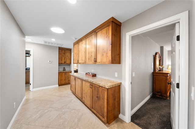 26280 Thacker Dr, Hemet, CA 92544 - interior space with recessed lighting, visible vents, brown cabinetry, and light countertops