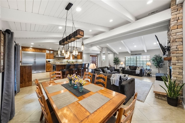 dining room featuring visible vents, lofted ceiling with beams, light tile patterned floors, recessed lighting, and wet bar