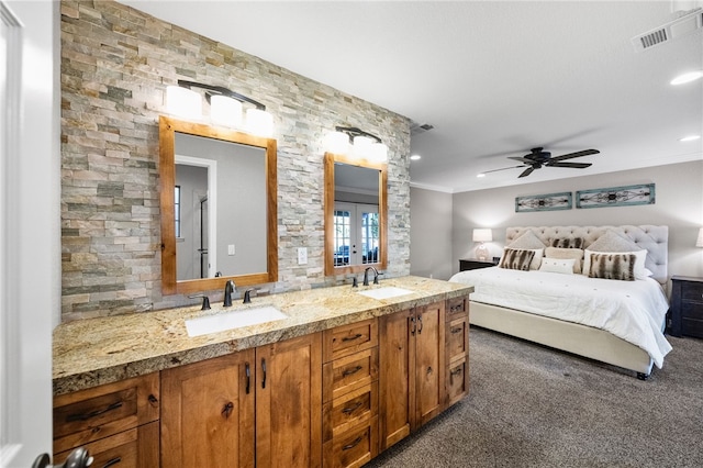 interior space featuring visible vents, ornamental molding, french doors, and a sink