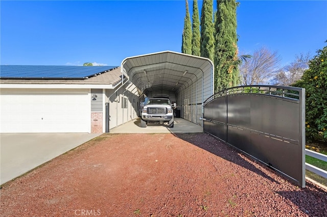 26280 Thacker Dr, Hemet, CA 92544 - exterior space featuring brick siding, a garage, roof mounted solar panels, a detached carport, and concrete driveway