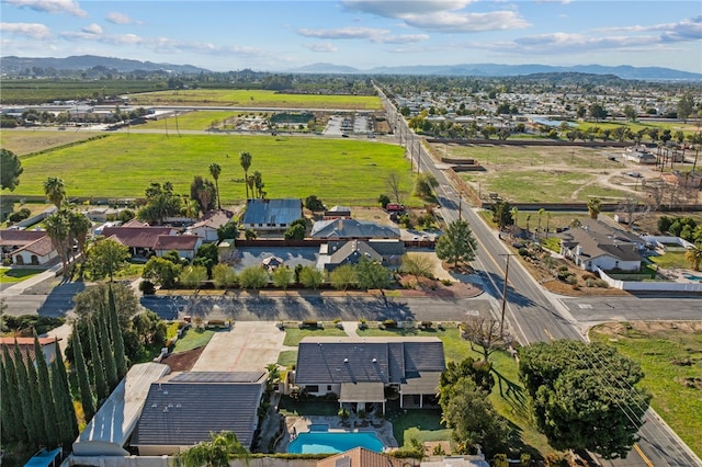 birds eye view of property featuring a mountain view