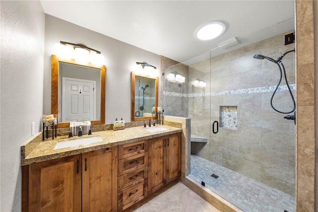 26280 Thacker Dr, Hemet, CA 92544 - bathroom featuring a shower stall, double vanity, and a sink