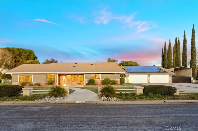 ranch-style home featuring a carport and driveway